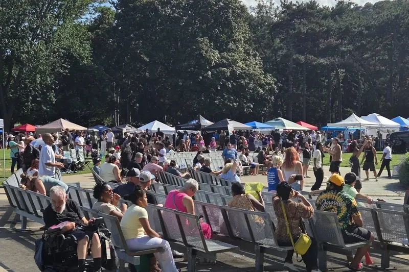 Crowds on benches and around vendor tents at Jesus Festival Hamilton 2026 in Gage Park